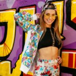 stylish girl posing near the wall with graffiti